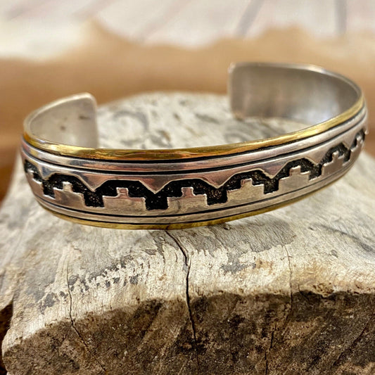 A stunning Tommy Singer original jewelry piece. Tommy Singer Native American jewelry is so unique and will add the perfect southwestern touch to any outfit and jewelry collection! Signed on the back T. Singer, Tommy singer jewelry hallmark. The Earp Cuff is an exquisite and lasting work of art. Handcrafted with the highest quality, it'll be a classic piece that stands the test of time. Wear a piece of history with a signature Tommy Singer piece.