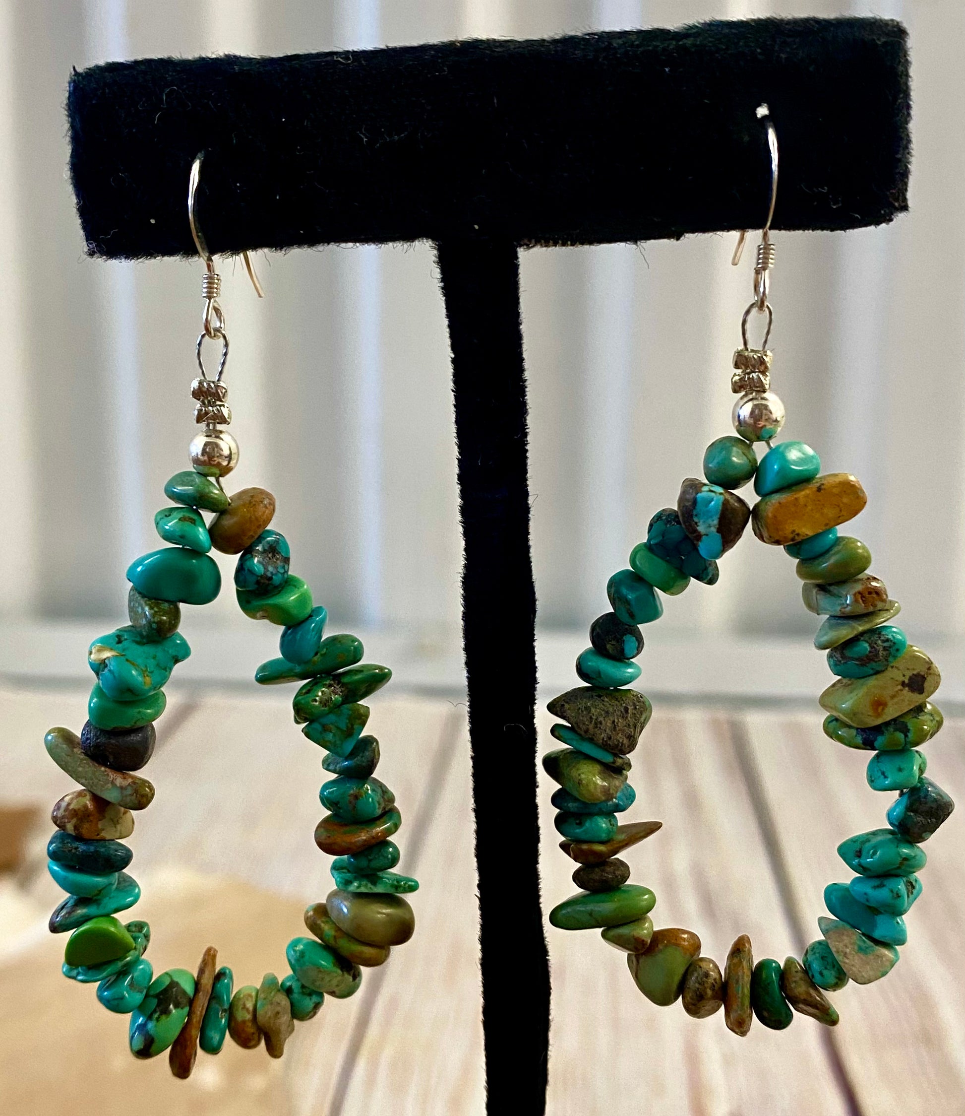 Native American Made Sterling Silver Turquoise Beaded Teardrop Earrings Lightweight turquoise chip sterling silver teardrop earrings. These Native made turquoise earrings are the perfect staple everyday piece to add to your jewelry collection or gift to a loved one! Easy to pair with almost any outfit for any occasion. From business casual to formal outfits.   Size: 2” inch length   Stone: Turquoise