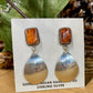 Stamped sterling orange spiny oyster post earrings with reflective mirror bottom. These spiny oyster Native American made earrings are stunning. They will make for an awesome statement piece in anyone's jewelry collection.   Size: 2" Inch Length  Stone: Spiny Oyster