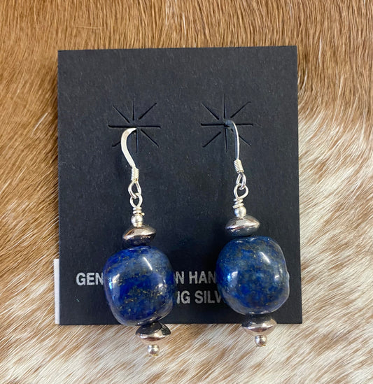﻿Lightweight single stone blue lapis ball sterling silver handmade Native made hook earrings. The perfect simple yet elegant earrings to add to your jewelry collection or gift to your loved one.   Size: 1” inch length   Stone: Lapis Native American Handmade Blue Lapis Sterling Silver Unique Earrings Sterling Silver Blue Earrings, Blue Lapis Handmade Jewelry, Native America Made