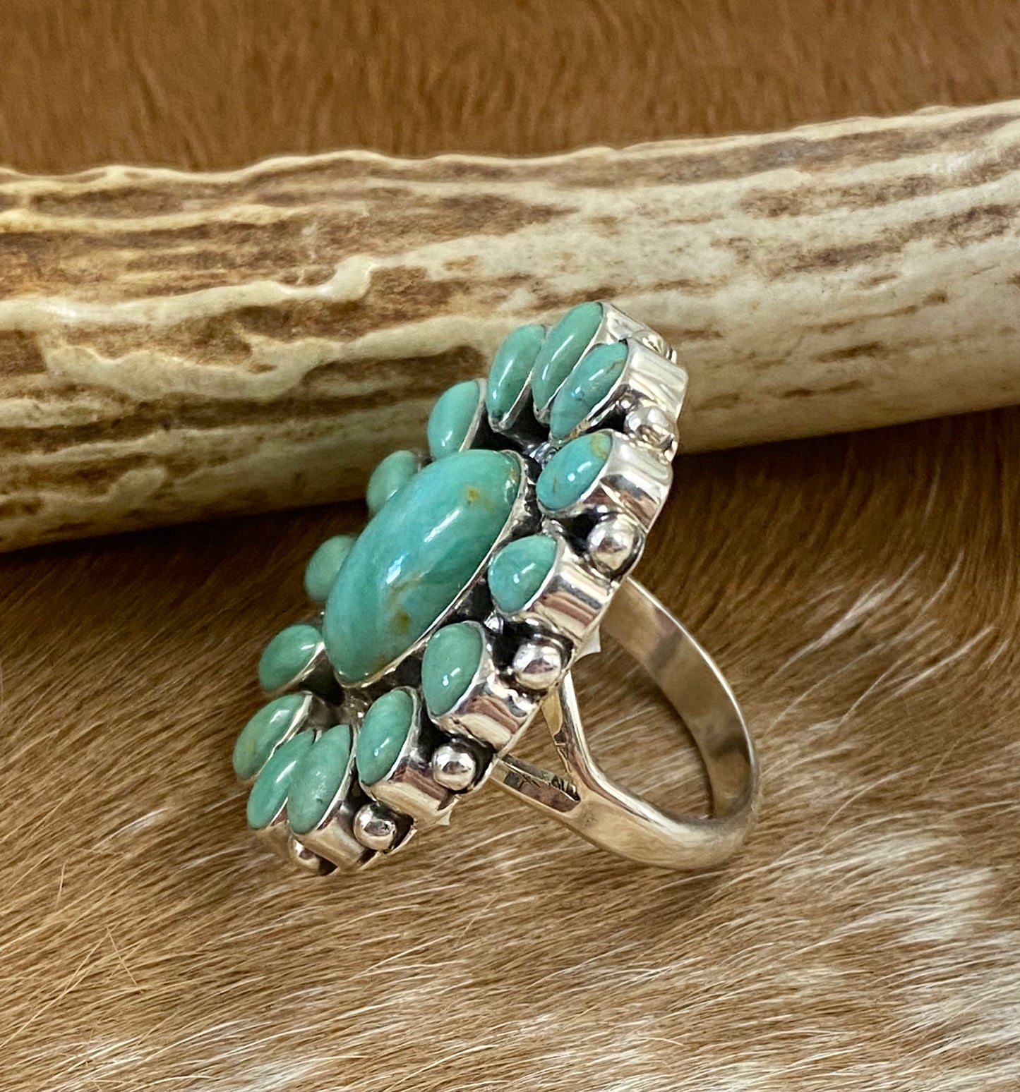 Sterling silver Tyrone Turquoise multi-stone turquoise cluster handmade unique statement size 7 1/4 ring.  The perfect piece to add to anyone's jewelry collection.    Size: Length 1 1/4” x  1 1/4” inches width   Ring Size: 7 1/4  Signed: YES Symbol   Stone: Tyrone Turquoise