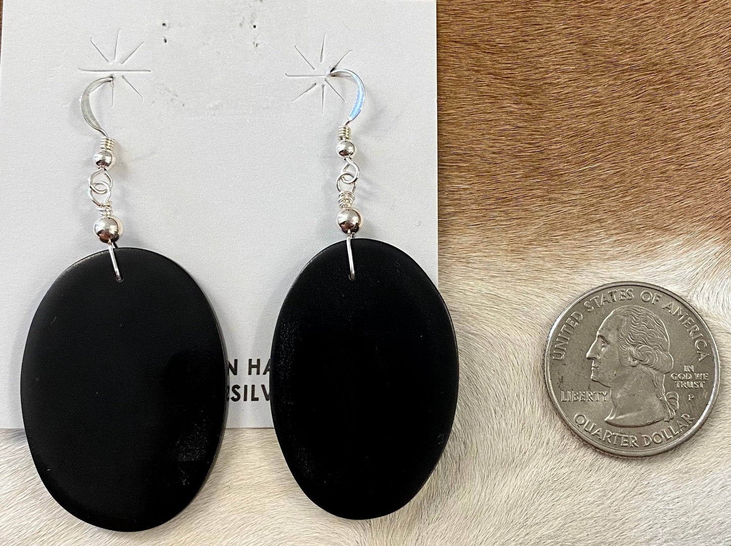 Jet black slab style hook authentic handmade sterling silver earrings. These earrings are gorgeous and simple.   What is the stone Jet?  Jet is a velvety black-colored gemstone that is a type of lignite. Jet is derived from decaying wood that undergoes extreme pressure and heat. The wood then becomes fossilized as a compact black material.The Alluring Jet Gemstone Earrings | Native Made Earrings 