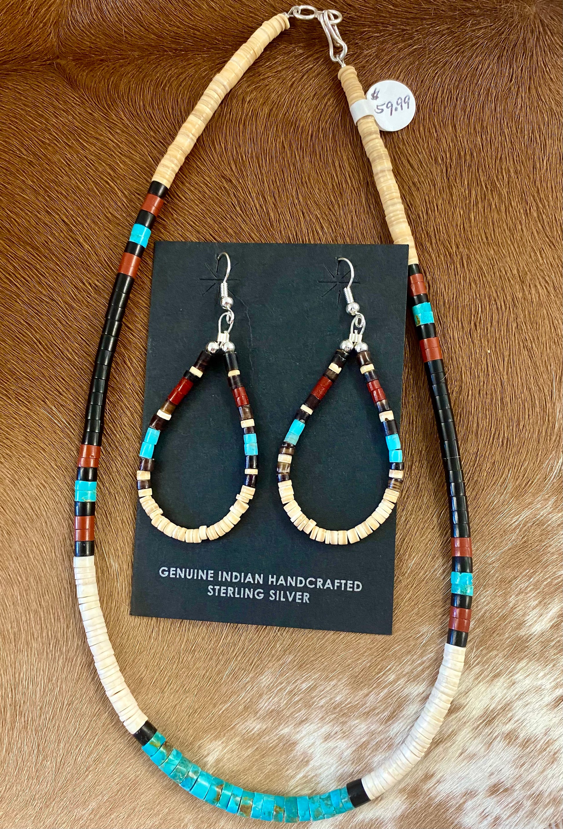 Beautiful turquoise, jet and heishi beaded teardrop sterling silver earrings. Made by talented Native American artist and silversmith Ella Mae Garcia.   Size: 2” Inches length x 1” inch width 